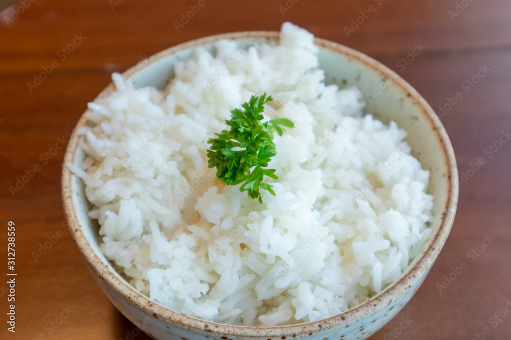 Small bowl of white rice with vegetable decorated on top. Small bowl of white rice with vegetable decorated on top.
