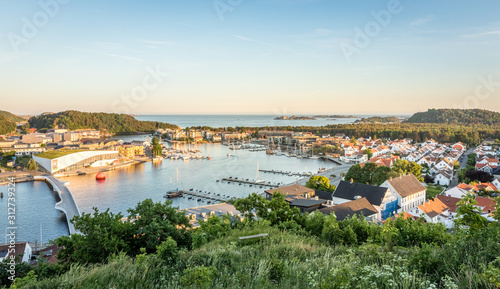 Mandal, a small city in the south of Norway. Seen from a height, with the sea and the sky in the background. photo