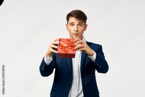 man with gift box isolated on white background © SHOTPRIME STUDIO