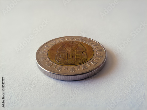 The Egyptian pound is the currency of Egypt. It is divided into 100 piastres, or ersh or 1,000 milliemes. Coin on white background. - Imge photo