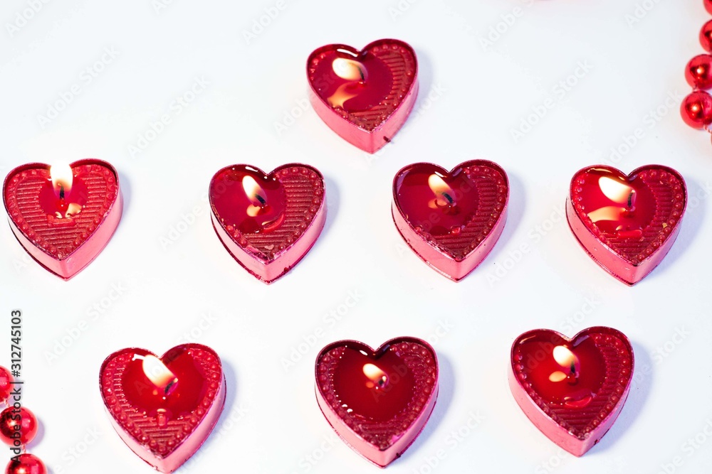 a heart shaped candle on a white background is a symbol of love a heart shaped candle on a white background is a symbol of love
