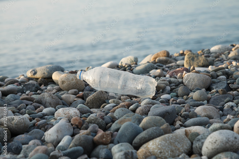 land and sea pollution pollution, ecological problem, used plastic bottle on sea shore land and sea pollution pollution, ecological problem, used plastic bottle on sea shore