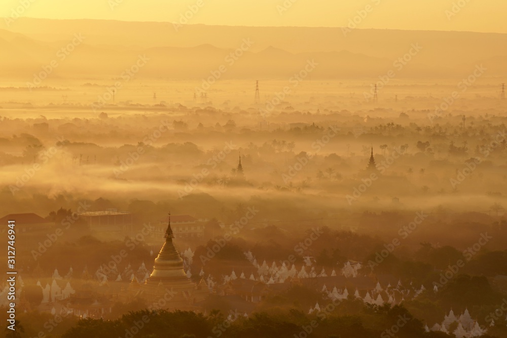 Top view of Mandalay city from Mandalay hill at the sunrise time that the sky turned orange