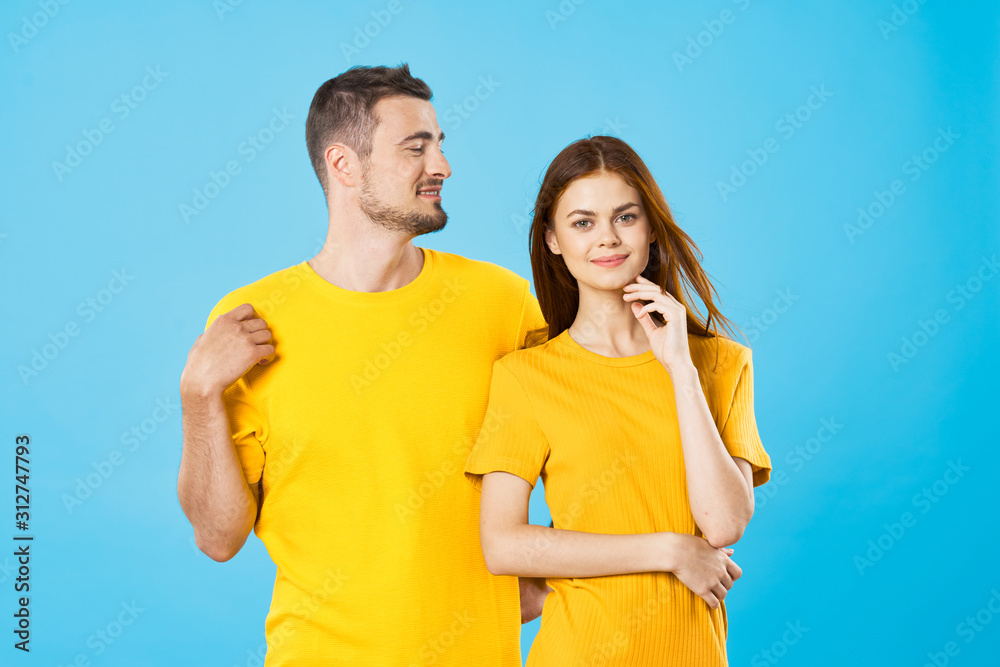 young couple in t-shirts chatting young couple in t-shirts chatting