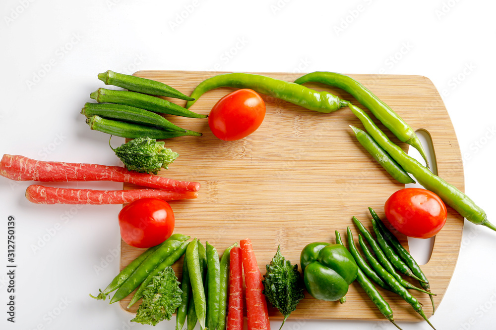 Raw vegetable on wooden board with copy space Raw vegetable on wooden board with copy space