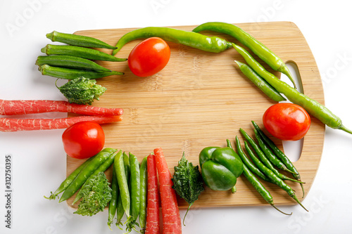 Raw vegetable on wooden board with copy space   photo