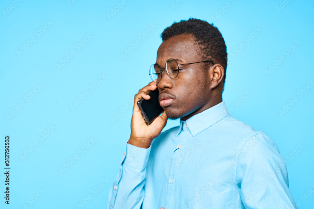 young man talking on cell phone young man talking on cell phone