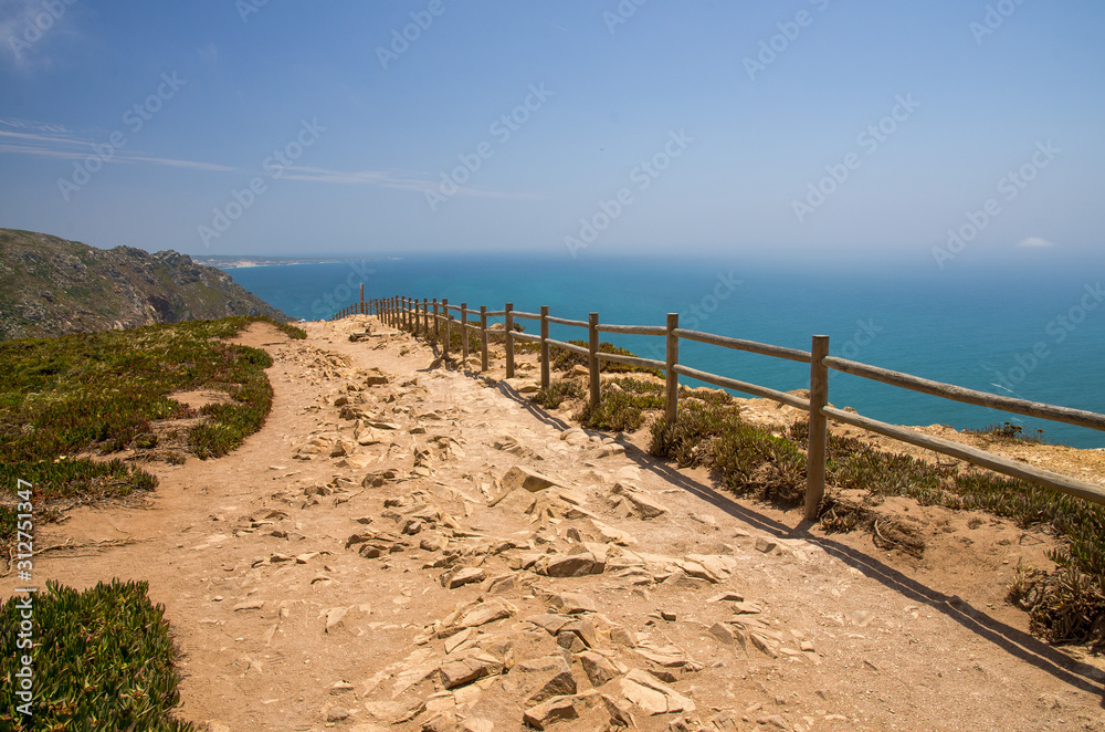 Portugal, Cabo da Roca, The Western Cape Roca of Europe,  hiking trails on the Cape Roca, ocean view from the Cape Roca, cliff above the Atlantic ocean, azure water in the Atlantica, wooden handrails