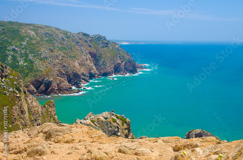 Fototapeta Naklejka Na Ścianę i Meble -  Portugal, The Western Cape Roca of Europe,  landscape of Cape Roca, Atlantic ocean coastline view from Cabo da Roca, Azure Atlantic water, cliffs of coastline at the extreme point of Europe