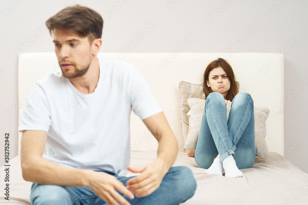 young couple sitting on sofa at home young couple sitting on sofa at home