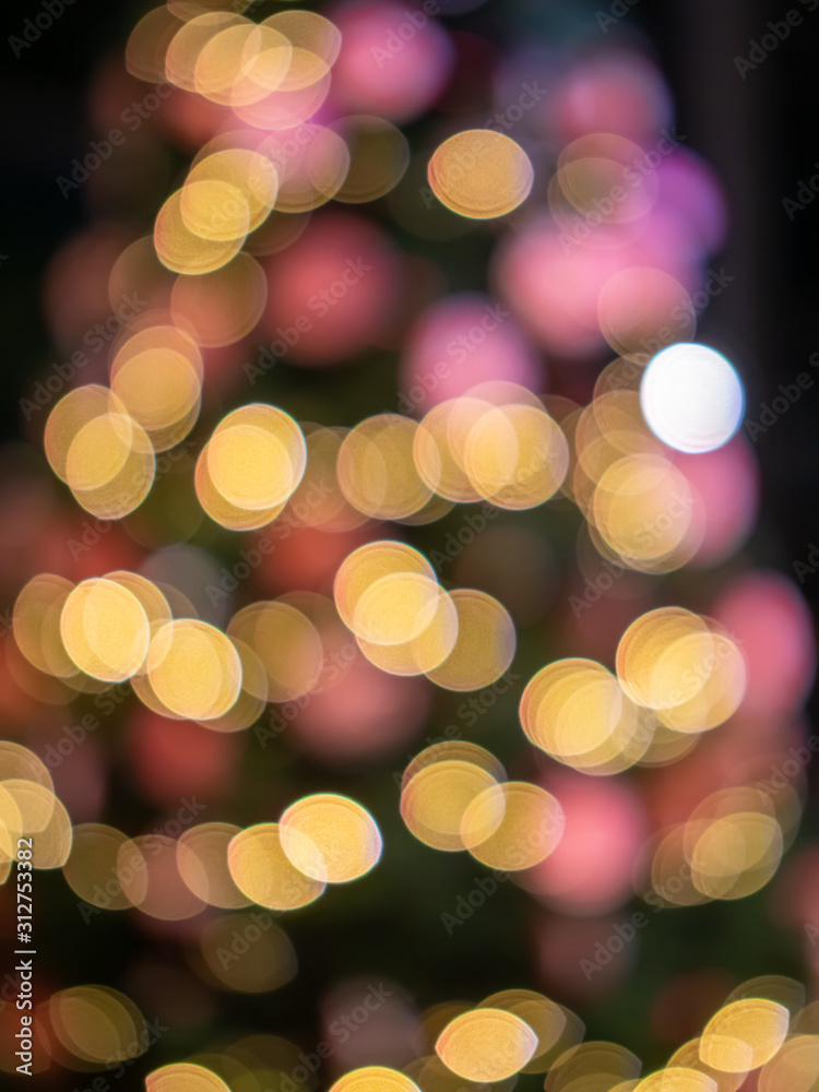 Obraz premium Blurred night light colorful circle bokeh background and effect