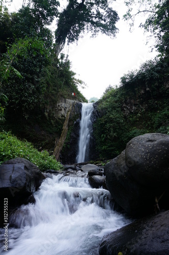 Rayap Waterfall is a beautiful place to visit with water coming from mountain sources photo