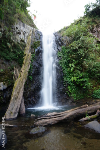 Rayap Waterfall is a beautiful place to visit with water coming from mountain sources photo
