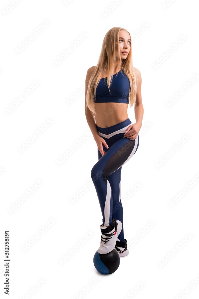 Pretty fitness model with a ball isolated view Pretty fitness model with a ball isolated view