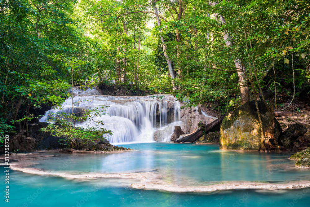 Waterfall and blue emerald water color in Erawan national park. Erawan Waterfall , Beautiful nature rock waterfall steps in tropical rainforest at Kanchanaburi province, Thailand Waterfall and blue emerald water color in Erawan national park. Erawan Waterfall , Beautiful nature rock waterfall steps in tropical rainforest at Kanchanaburi province, Thailand