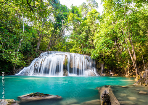 Waterfall and blue emerald water color in Erawan national park. Erawan Waterfall , Beautiful nature rock waterfall steps in tropical rainforest at Kanchanaburi province, Thailand