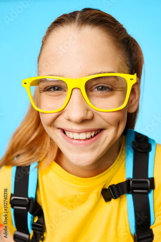 portrait of little girl in glasses