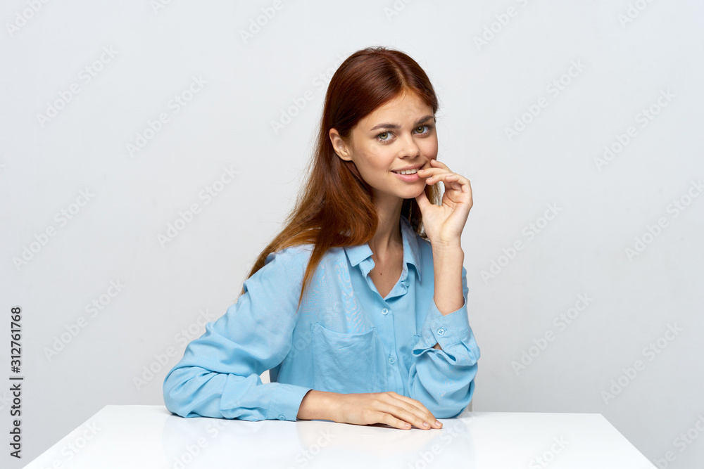 portrait of young woman sitting on a sofa portrait of young woman sitting on a sofa