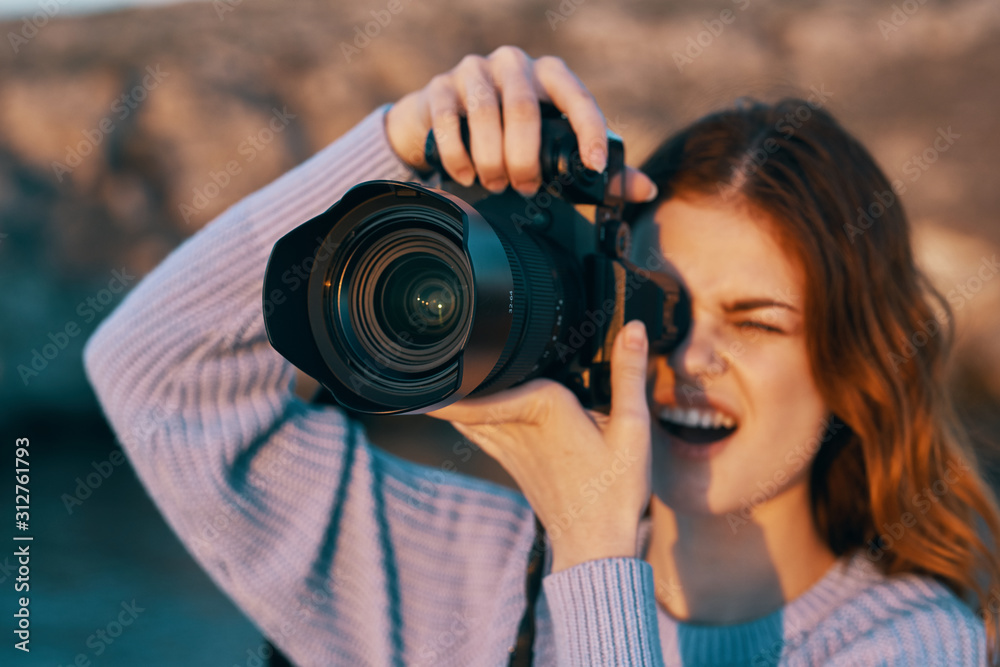 woman taking photo with digital camera woman taking photo with digital camera