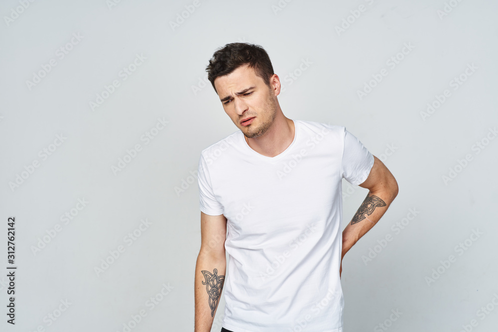 portrait of young man with arms crossed portrait of young man with arms crossed