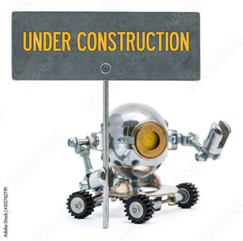 Steampunk robot holding metal sign with text "Under Construstion". Cyberpunk style. Chrome and bronze parts.