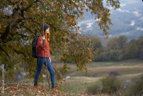 young woman walking in autumn park © SHOTPRIME STUDIO