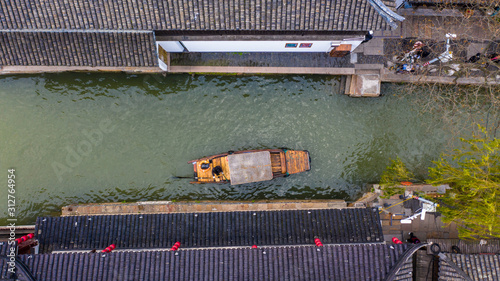 Aerial view Zhujiajiao Water Town and China traditional tourist boats on canals of Shanghai Zhujiajiao Water Town in Shanghai, China. photo