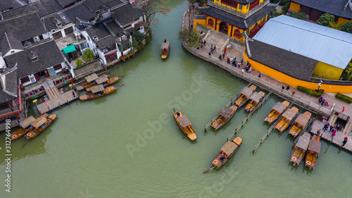 Aerial view Zhujiajiao Water Town and China traditional tourist boats on canals of Shanghai Zhujiajiao Water Town in Shanghai, China. © Kalyakan