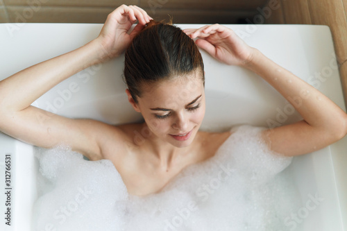young woman relaxing in bath