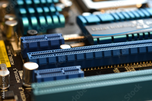 Motherboard with blue PCI-express slot, close-up and selective focusing photo