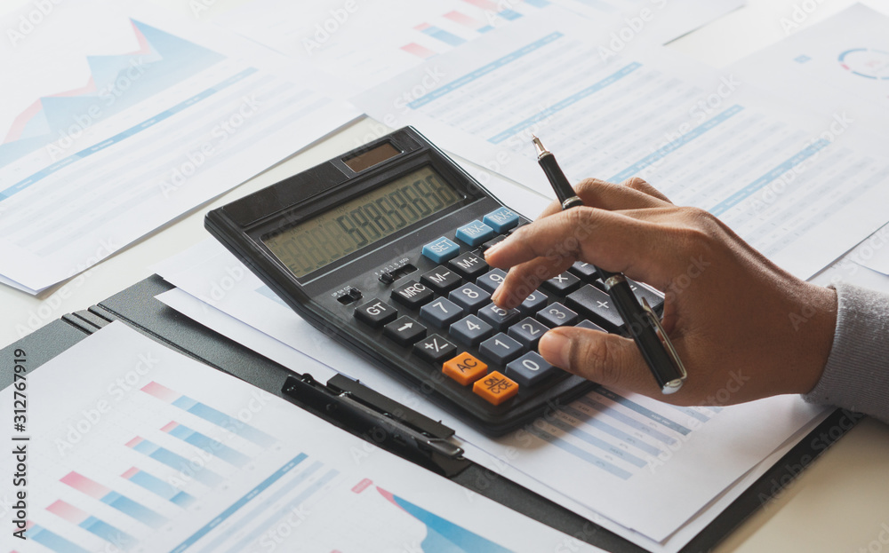 businessman working calculate data document graph chart report marketing research development planning management strategy analysis financial accounting. Business office concept. businessman working calculate data document graph chart report marketing research development planning management strategy analysis financial accounting. Business office concept.