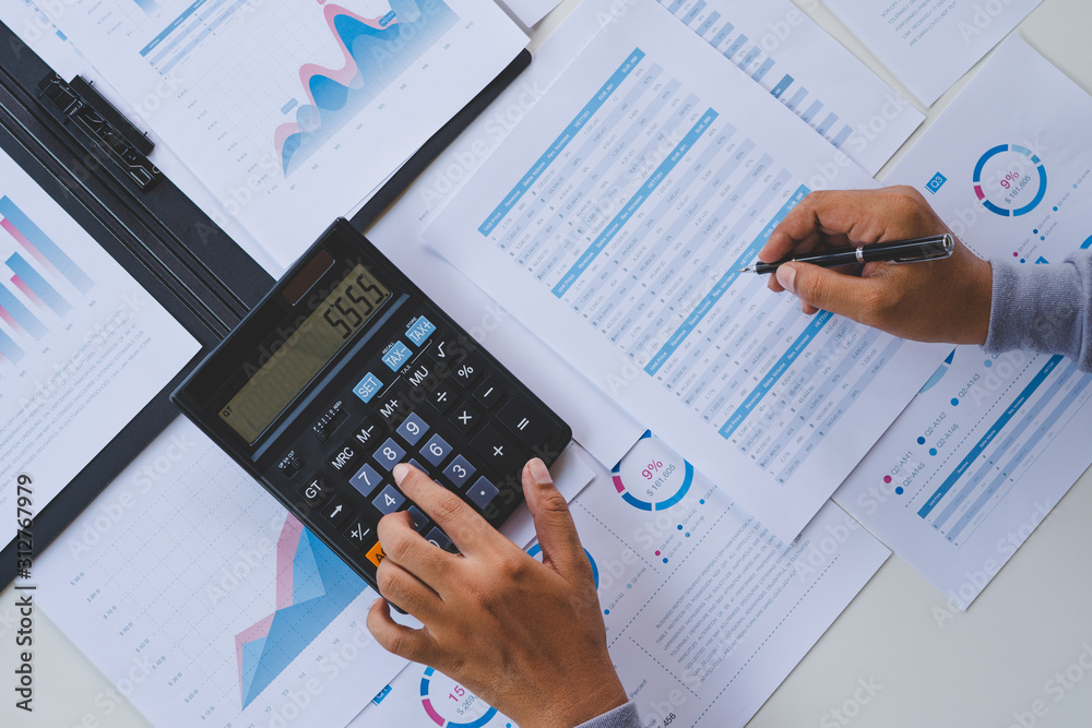businessman working calculate data document graph chart report marketing research development planning management strategy analysis financial accounting. Business office concept. businessman working calculate data document graph chart report marketing research development planning management strategy analysis financial accounting. Business office concept.