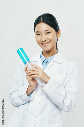 young doctor with syringe