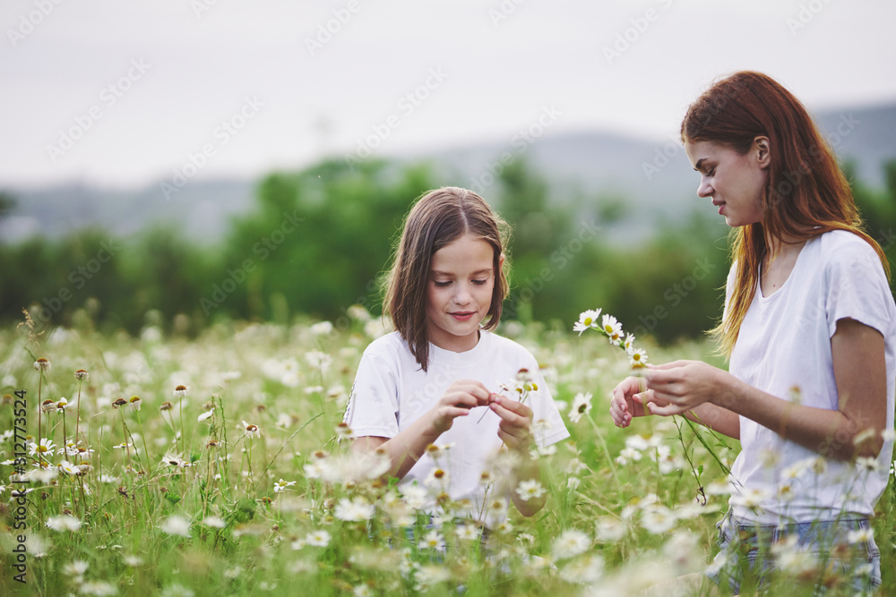 mother and daughter in the field mother and daughter in the field