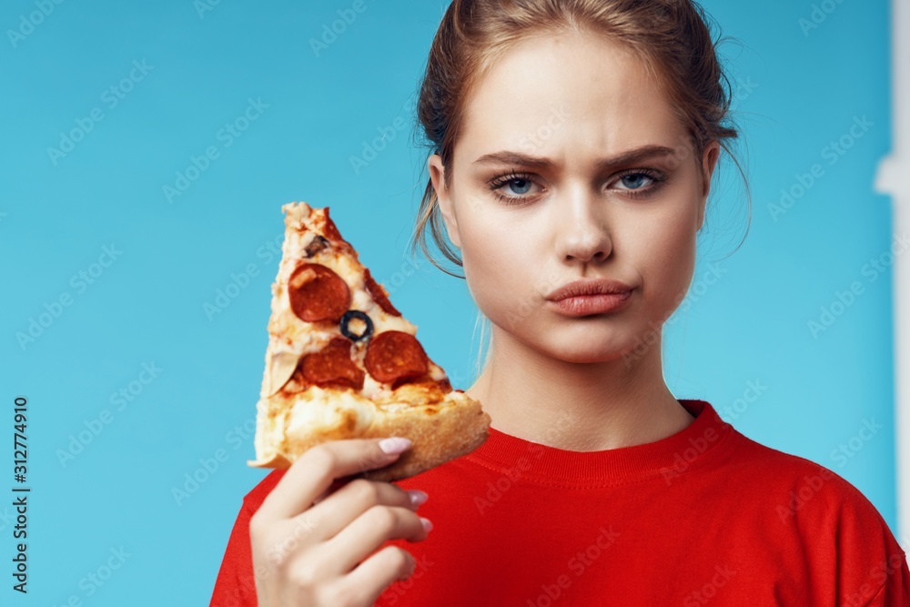 woman eating pizza