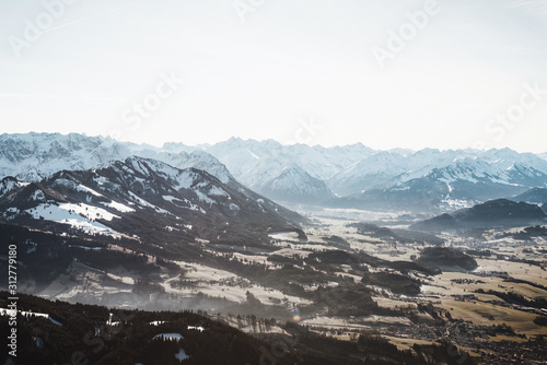 Aerial view of winter mountain landscape with snow covered peaks. Bavarian mountains in the Allgaeu area near Oberstdorf, Germany © XtravaganT