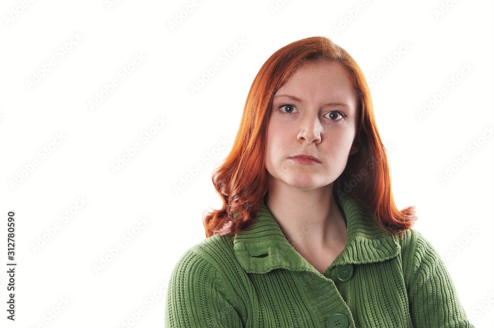 serious unhappy young woman with red hair isolated on white background serious unhappy young woman with red hair isolated on white background