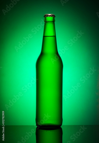 Bottle of beer on green