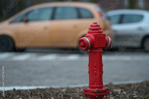 Fototapeta Naklejka Na Ścianę i Meble -  red hydrant on the street, fire protection