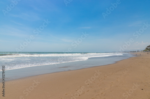 Seminyak beach. Wide sand beach with big waves, good for surfing  Bali island, Indonesia © umike_foto