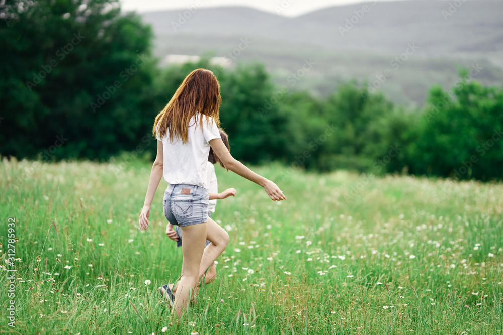 Fototapeta premium young woman running in the field