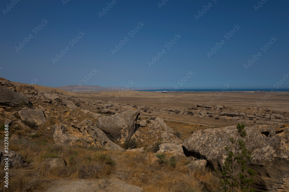 Gobustan is an Archaeological reserve in Azerbaijan, South of Baku. Rock drawings Gobustan is an Archaeological reserve in Azerbaijan, South of Baku. Rock drawings