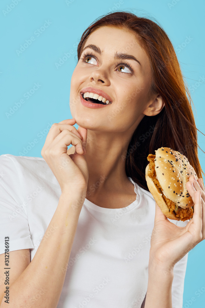 portrait of young woman eating donut portrait of young woman eating donut