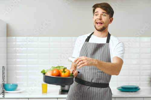 woman cooking vegetables in kitchen