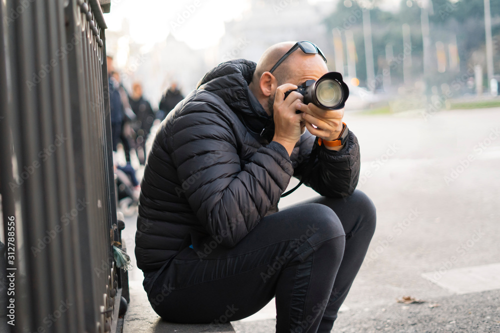 attractive man with photo camera making portrait attractive man with photo camera making portrait