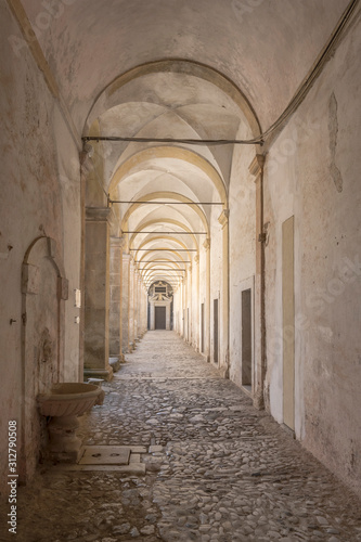 summer light under San Lorenzo Certosa cloister covered walkway , Padula, Italy