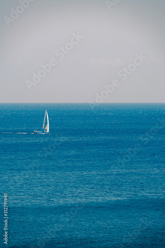 View on the seaside landscape Milos island at Paliochori beach at summer sun photo