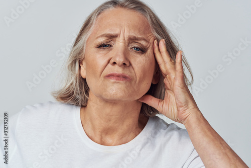 senior woman with headache