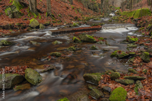 Waterfall of Chomutovka river near Chomutov town in winter morning photo