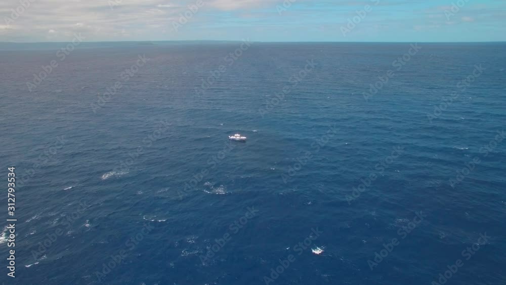 Solitary Boat in The Middle of Ocean. Static Aerial Shot With Endless Horizon Solitary Boat in The Middle of Ocean. Static Aerial Shot With Endless Horizon